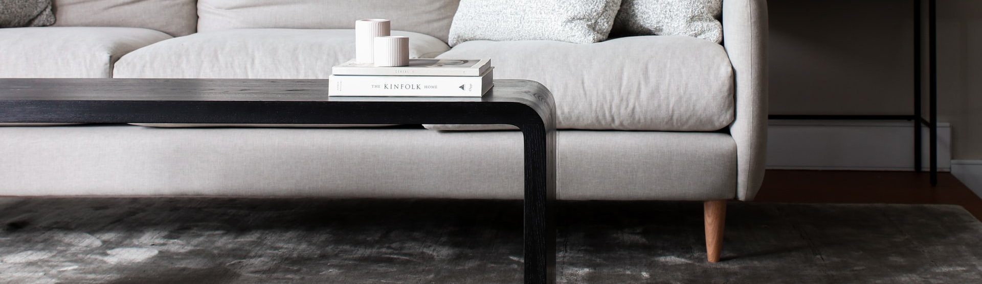 white couch and black coffee table on a brown hardwood floor from Johnson & Sons Flooring in Knoxville, TN